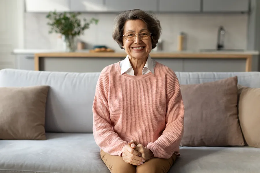 Smiling woman relaxing on a sofa